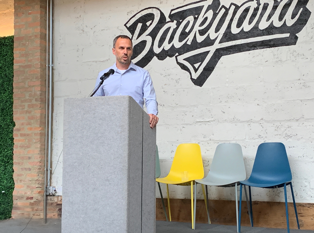 Daniel Riemenschneider speaking at a community event