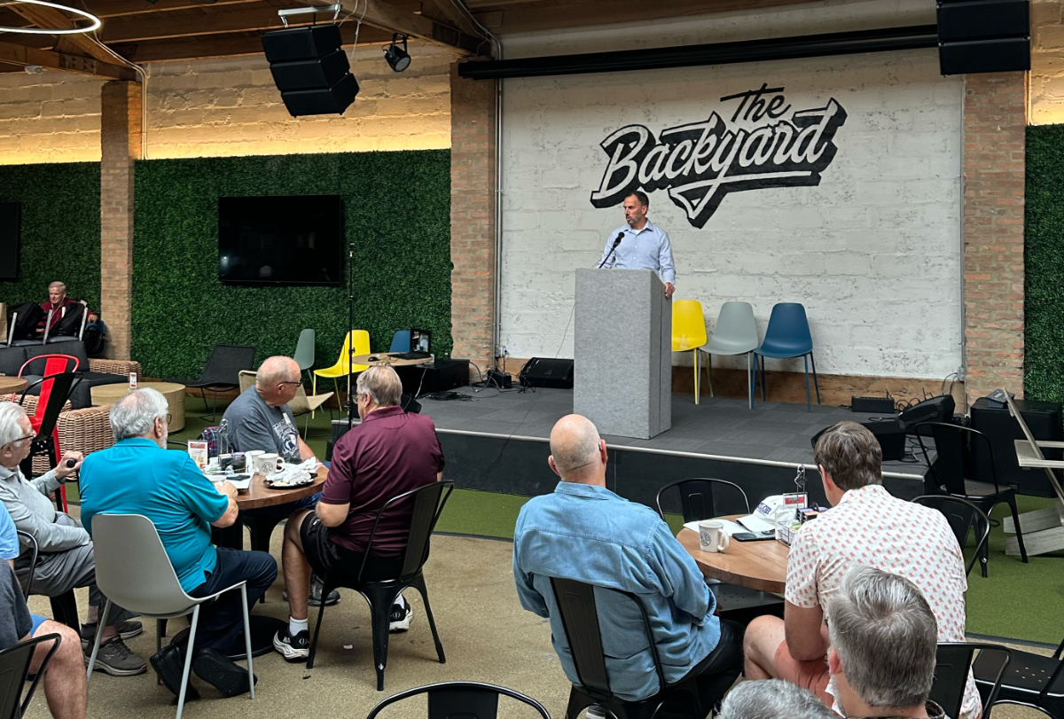 Daniel Riemenschneider speaking with local leaders